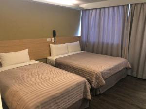 Postel nebo postele na pokoji v ubytování Chance Hotel