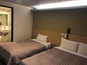 Postel nebo postele na pokoji v ubytování Chance Hotel