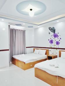 Ένα ή περισσότερα κρεβάτια σε δωμάτιο στο Homestay Gia Phú