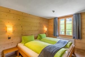 En eller flere senger på et rom på Hotel Des Alpes