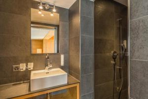 Koupelna v ubytování Hotel Des Alpes + 37 fotografií