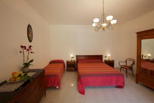 A bed or beds in a room at Agriturismo La Lobra