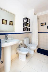 a bathroom with a toilet and a sink at Sweet Home in Santa Cruz de Tenerife