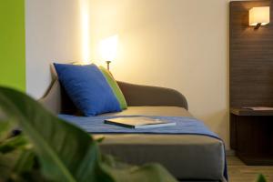 Posteľ alebo postele v izbe v ubytovaní Residenza del Borgo