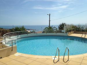 a large swimming pool on top of a building at Luxury apartment facing the Mediterranean in Sète