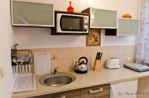 Kuchyň nebo kuchyňský kout v ubytování Apartamenty z Klimatem