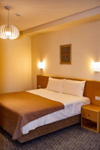 Postel nebo postele na pokoji v ubytování Hotel Airport Tirana