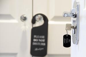 a lock on a door with a key at The Glebe Hotel in Liverpool