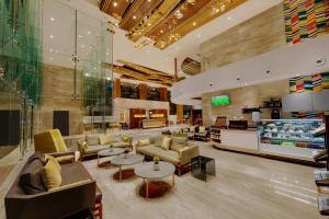 a lobby with couches and tables in a store at UK 27 The Fern, Belagavi in Belgaum
