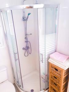 a shower stall with a bike in a bathroom at TENERIFE LITTLE VILLAGE S in San Isidro