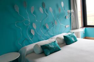 Postel nebo postele na pokoji v ubytování Hotel Araz