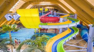 an overhead view of a water slide at a water park at Kopel Haus - Studio - Self acces cod location in Baloteşti