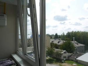 an open window with a view of a city at Хмельницьке шосе 122а in Vinnytsya