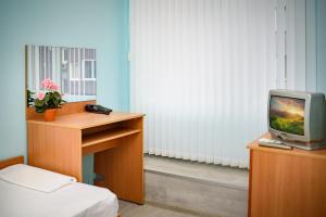 A television and/or entertainment centre at Family Hotel Varna