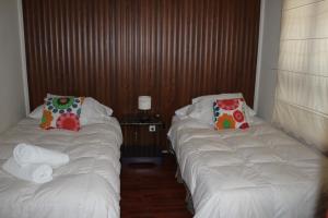 Cama o camas de una habitación en Hotel Milodon