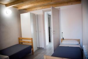 Giường trong phòng chung tại Appartamento San Raffaele