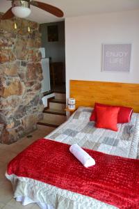 Cama o camas de una habitación en Hogar del Viento, Piscina Privada y Vista panorámica al Mar