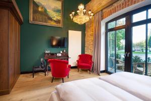 Postel nebo postele na pokoji v ubytování Hotel Rittergut Osthoff