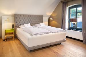 Postel nebo postele na pokoji v ubytování Hotel Rittergut Osthoff