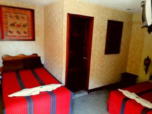 Cama o camas de una habitación en Hostal Abu