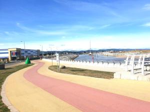 a walkway next to a body of water at Gabriel Guesthouse in Rhyl