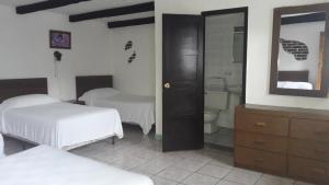 Postel nebo postele na pokoji v ubytování Hotel De Cortez y Larraz