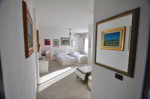 Postel nebo postele na pokoji v ubytování Aparthotel Shkodra