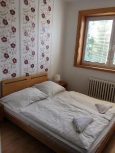 Postel nebo postele na pokoji v ubytování Holiday Park Vrchlabí - Liščí farma