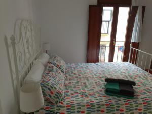 A bed or beds in a room at HISPALIS SAN LUIS