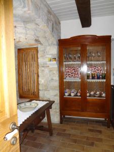 a bathroom with a sink and a wooden cabinet at Bed And Breakfast Pa' Carrera in Fragneto Monforte