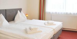 Posteľ alebo postele v izbe v ubytovaní Hotel-Restaurant Moser Pöchlarn