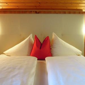 A bed or beds in a room at Alpine Active Weitgasser