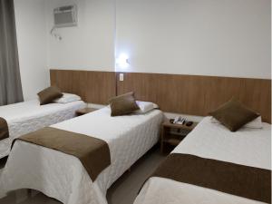 Postel nebo postele na pokoji v ubytování Al Mare Hotel