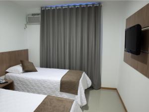 Postel nebo postele na pokoji v ubytování Al Mare Hotel