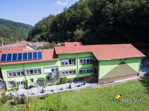 a large house with a red roof at Casa Flori de Nuc in Moneasa