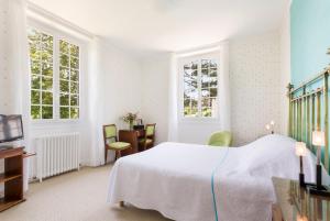 Ein Bett oder Betten in einem Zimmer der Unterkunft Hotel Les Goelands