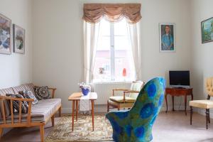 a living room with a couch and a chair at 58 Turistvägen Järvsö in Järvsö