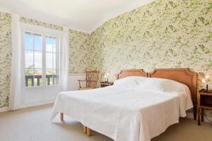 Ein Bett oder Betten in einem Zimmer der Unterkunft Hotel Les Goelands
