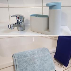 W łazience znajduje się umywalka i kran. w obiekcie Hotel Garni w mieście Herborn