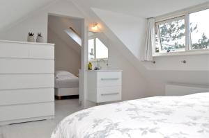 Ένα ή περισσότερα κρεβάτια σε δωμάτιο στο Beachhouse Bosweg
