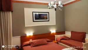 Кровать или кровати в номере Hotel Minerva