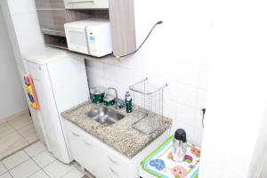 Η κουζίνα ή μικρή κουζίνα στο Olímpia Temporada Cond. Villagio +53 φωτογραφίες