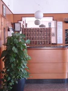 A kitchen or kitchenette at Petit Hotel