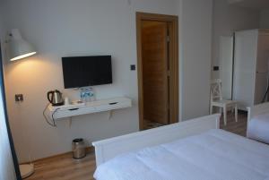 Giường trong phòng chung tại Eleia Hotel İznik