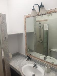 A bathroom at Santa Barbara by Placida Mar