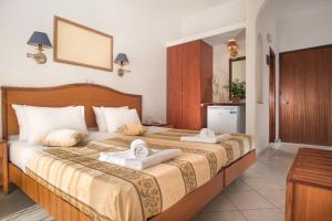 Postel nebo postele na pokoji v ubytování Hotel Meltemi