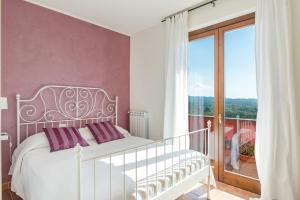 Postel nebo postele na pokoji v ubytování Casale La Desdemona