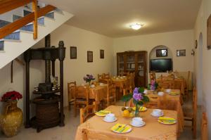 a dining room with wooden tables and a fireplace at Agriturismo La Lobra in Massa Lubrense +63 photos
