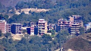 a group of tall buildings in a city at Panorama Guest House in Nagarkot
