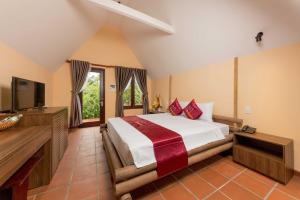 Ένα ή περισσότερα κρεβάτια σε δωμάτιο στο La Paloma Resort +61 φωτογραφίες